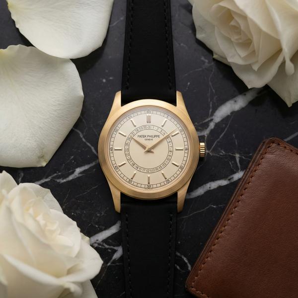 Detail of a luxury watch with intricate design and sparkling diamonds.