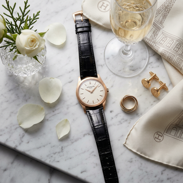Patek Philippe watch on Carrara marble with Dom Pérignon