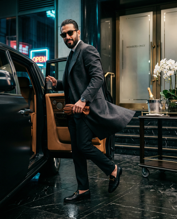Worm's-eye luxury arrival by Rolls‑Royce with Tom Ford overcoat