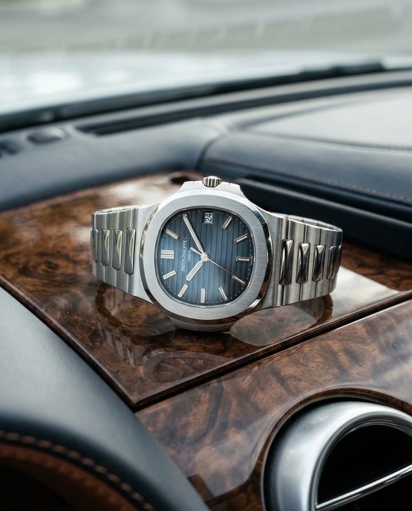 Close-up of Patek Philippe watch on Bentley Continental GT dashboard