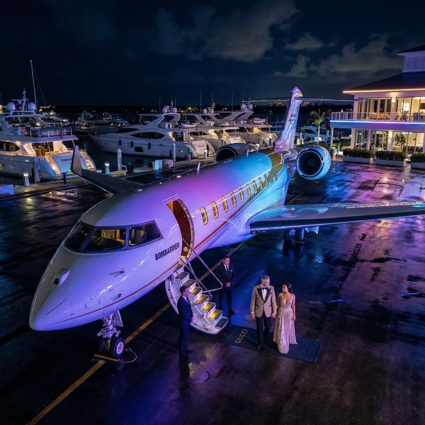 Overhead view of yacht club tarmac at night featuring Bombardier Global 7500