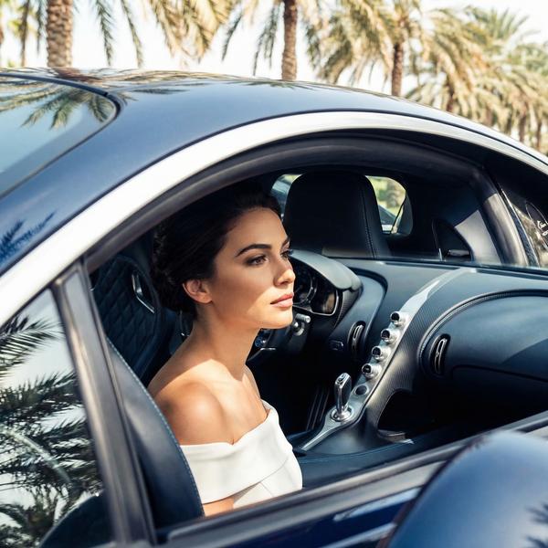 Close-up of Bugatti Chiron driver side, showcasing luxury design details.