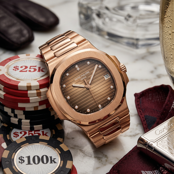 Patek watch on Calacatta marble with high-value casino chips