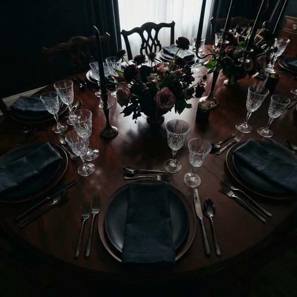 Overhead view of a dark luxury dining table setting