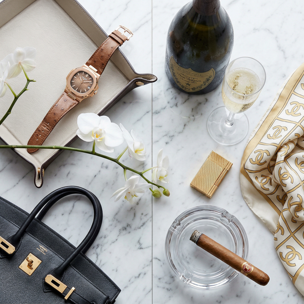 Patek watch and Hermès Birkin on Carrara marble with Cristal