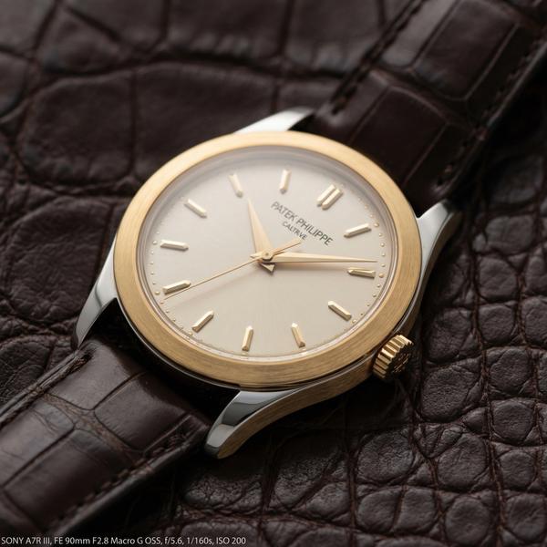 Closeup of leather and gold watch highlighting luxury craftsmanship