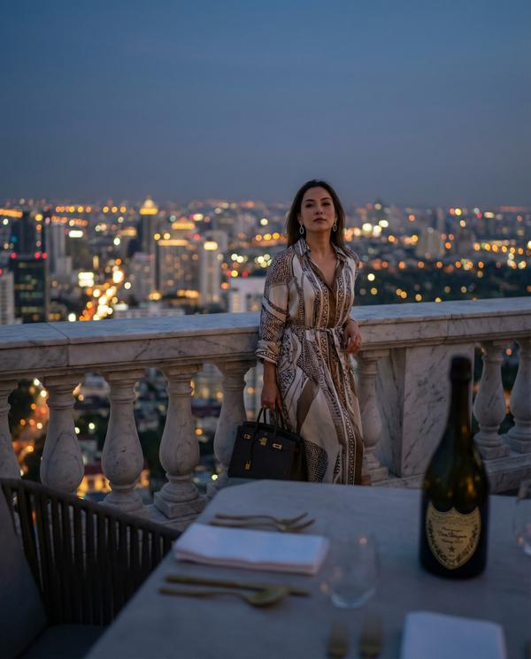 Evening view from penthouse terrace overlooking city skyline