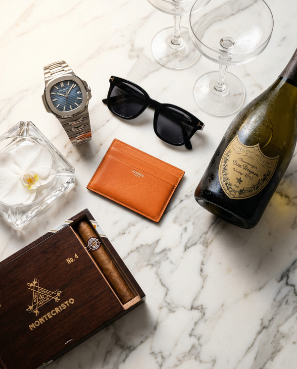 Patek Nautilus on Calacatta marble with Dom Pérignon flatlay