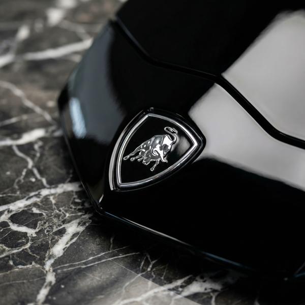 Detailed shot of Lamborghini Aventador on a luxurious marble surface