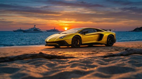 Portrait of a Lamborghini Aventador against a sunset beach backdrop