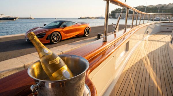 Wide view from a champagne rail deck showcasing the luxury McLaren 720S.