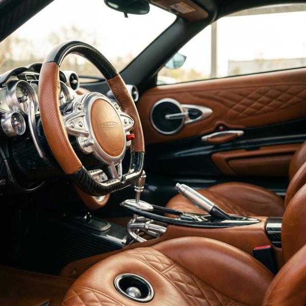 Exclusive interior luxury of a Pagani, highlighting exquisite craftsmanship.