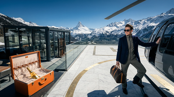 Rooftop helipad at Zermatt chalet with helicopter and wealthy host