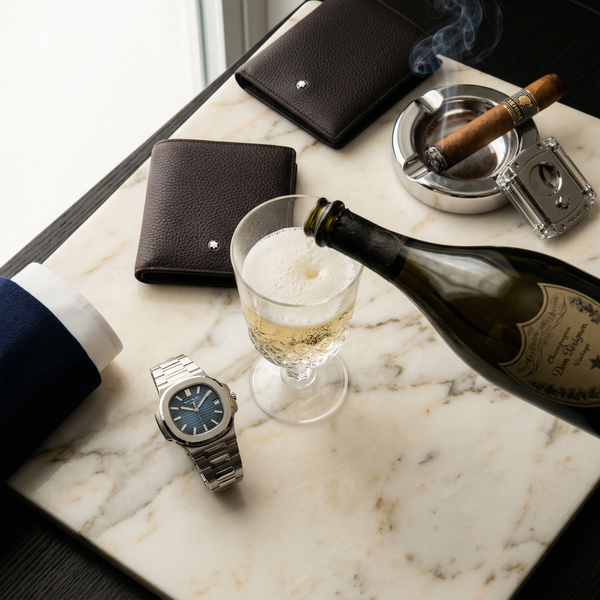 Patek Nautilus on Calacatta marble with Dom Pérignon