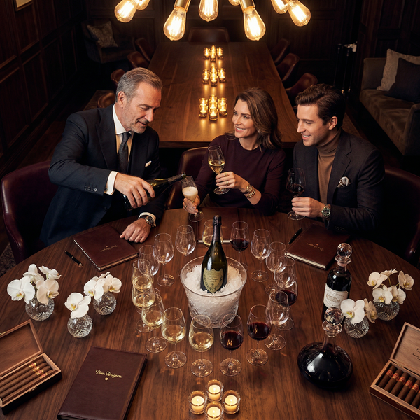 Overhead trio tasting at walnut table with Dom Pérignon magnum